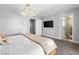 Cozy bedroom features neutral walls and a modern light fixture at 120 W Highland Dr, Henderson, NV 89015