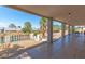 View from the covered patio and view of pool with surrounding desert landscaping at 120 W Highland Dr, Henderson, NV 89015