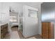 Beautiful bathroom featuring a glass-enclosed shower, wood-look tile flooring, and bedroom view at 1310 Ripplestone Ave, North Las Vegas, NV 89081