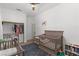 Bright Bedroom with a gray crib, a convenient washer/dryer closet, and stylish decor at 1310 Ripplestone Ave, North Las Vegas, NV 89081