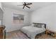 Comfortable bedroom featuring neutral colors, a queen-sized bed and a window with blinds at 1310 Ripplestone Ave, North Las Vegas, NV 89081