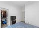 Cozy bedroom with a patterned bedspread, closet and television at 1310 Ripplestone Ave, North Las Vegas, NV 89081