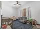 Charming Bedroom with two cribs, patterned rug, and plenty of storage for toys and books at 1310 Ripplestone Ave, North Las Vegas, NV 89081