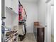 Organized walk-in closet with shelving for shoes, hanging clothes and extra storage cabinet at 1310 Ripplestone Ave, North Las Vegas, NV 89081