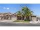 Charming single-Gathering home with mature landscaping, two-car garage, and an inviting entryway at 1310 Ripplestone Ave, North Las Vegas, NV 89081