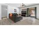 Inviting living room with stylish decor, hardwood floors, and a sliding glass door to the outdoor patio at 1310 Ripplestone Ave, North Las Vegas, NV 89081