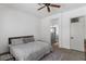 Serene bedroom with a comfortable queen-sized bed and an ensuite bathroom with glass shower at 1310 Ripplestone Ave, North Las Vegas, NV 89081