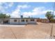 Backyard featuring dirt landscaping, a storage shed, and a white house at 1313 Purple Sage Ave, Las Vegas, NV 89108