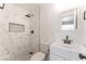 Well-lit bathroom featuring marble tile, a modern vanity, and a stylish shower at 1313 Purple Sage Ave, Las Vegas, NV 89108
