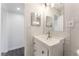 Stylish bathroom featuring modern vanity, updated fixtures and stylish tiling at 1313 Purple Sage Ave, Las Vegas, NV 89108