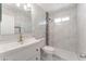 Elegant bathroom featuring marble tile, a modern vanity, and a walk-in shower at 1313 Purple Sage Ave, Las Vegas, NV 89108