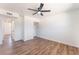 Cozy bedroom with wood-look floors, closet space, and ceiling fan at 1313 Purple Sage Ave, Las Vegas, NV 89108