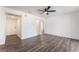Spacious bedroom featuring laminate floors, a ceiling fan, and fresh white paint at 1313 Purple Sage Ave, Las Vegas, NV 89108