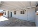 Attached carport with covered parking, exterior lighting, and pedestrian doors at 1313 Purple Sage Ave, Las Vegas, NV 89108