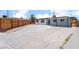 Charming single-story home featuring a long driveway, covered parking, and a privacy fence surrounding the backyard at 1313 Purple Sage Ave, Las Vegas, NV 89108
