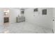 Versatile flex room featuring tile floors, kitchenette, and natural light at 1313 Purple Sage Ave, Las Vegas, NV 89108