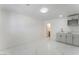 Spacious room with tile floors and a modern kitchenette perfect for a flexible living space at 1313 Purple Sage Ave, Las Vegas, NV 89108