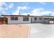 Charming single-story home featuring fresh gravel landscaping, a long driveway, and covered parking at 1313 Purple Sage Ave, Las Vegas, NV 89108