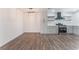 Spacious eat-in kitchen with stainless appliances, floating shelves and modern light fixture at 1313 Purple Sage Ave, Las Vegas, NV 89108