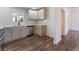 Modern kitchen features updated countertops, stainless steel appliances, and wood-look flooring at 1313 Purple Sage Ave, Las Vegas, NV 89108
