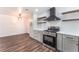 Well-designed kitchen with stainless steel oven, wooden shelves, and elegant countertop at 1313 Purple Sage Ave, Las Vegas, NV 89108
