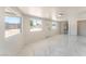 Bright, sunlit bonus room featuring tile flooring and ample natural light from windows at 1313 Purple Sage Ave, Las Vegas, NV 89108