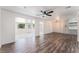 Spacious living room with new wood flooring and natural light, connecting multiple rooms at 1313 Purple Sage Ave, Las Vegas, NV 89108