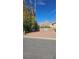 Desert landscape lot with mature trees and views of the surrounding mountains at 1330 Honey Lake St, Las Vegas, NV 89110