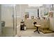 Spacious bathroom featuring a glass-enclosed shower, soaking tub, and dual vanities at 1830 Lake Wales St, Henderson, NV 89052