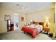 Inviting bedroom with soft lighting, carpeted floors, and an adjacent study space at 1830 Lake Wales St, Henderson, NV 89052