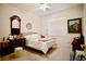 Cozy bedroom with a comfortable bed, window, and ceiling fan, ideal for relaxation at 1830 Lake Wales St, Henderson, NV 89052