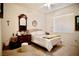 Comfortable bedroom featuring a cozy bed, ceiling fan, and natural light from the window at 1830 Lake Wales St, Henderson, NV 89052