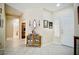 Inviting entryway with neutral walls, tiled flooring, and display cabinet at 1830 Lake Wales St, Henderson, NV 89052