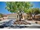 Charming single-story home featuring a well-maintained front yard and a two-car garage at 1830 Lake Wales St, Henderson, NV 89052
