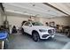 Spacious garage featuring a clean, organized space with a sleek white vehicle parked inside at 1830 Lake Wales St, Henderson, NV 89052