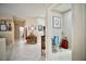 Inviting hallway with tile flooring, neutral walls, and decor throughout the home at 1830 Lake Wales St, Henderson, NV 89052