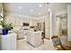 Spacious kitchen with island, stainless steel appliances, and light-colored cabinetry at 1830 Lake Wales St, Henderson, NV 89052