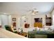 Bright living room featuring comfortable seating, neutral walls, and ceiling fan at 1830 Lake Wales St, Henderson, NV 89052