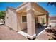 Charming covered patio area with outdoor seating, perfect for relaxing or entertaining guests at 1830 Lake Wales St, Henderson, NV 89052