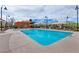 Inviting community pool featuring lounge chairs and a dining area, ideal for relaxation and social gatherings at 1904 Via Firenze, Henderson, NV 89044