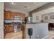 Well-appointed kitchen featuring stainless steel appliances, wood cabinets, and recessed lighting at 1904 Via Firenze, Henderson, NV 89044