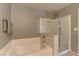 Relaxing bathroom with soaking tub and separate glass-enclosed shower at 1904 Via Firenze, Henderson, NV 89044
