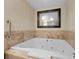 Bathroom features a luxurious soaking tub with marble trim, perfect for relaxation at 2000 N Fashion Show Dr # 3000, Las Vegas, NV 89109
