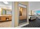 Bathroom reflected in a mirror, featuring a vanity with double sinks, and storage at 2000 N Fashion Show Dr # 3000, Las Vegas, NV 89109