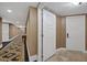 Hallway with patterned carpet, warm neutral walls, and doorways to various units at 2000 N Fashion Show Dr # 3000, Las Vegas, NV 89109