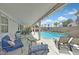 Enjoy this backyard with pool, covered patio, lounge chairs, and dining; perfect for outdoor gatherings at 2011 Mountain Sunset Ave, North Las Vegas, NV 89031