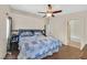 Cozy main bedroom with a ceiling fan, hardwood floor, and an ensuite bathroom at 2011 Mountain Sunset Ave, North Las Vegas, NV 89031