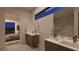 Modern bathroom featuring double vanities and a walk-in shower at 25 Sand Star Ln, Henderson, NV 89011