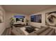 Comfortable living room featuring a large sectional sofa and modern artwork at 25 Sand Star Ln, Henderson, NV 89011
