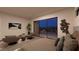 Spacious main bedroom with a sitting area and large sliding glass doors overlooking the patio at 25 Sand Star Ln, Henderson, NV 89011